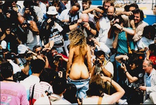 Item #16-4792 Original large format photograph of a woman undressing for photographers at Cannes....
