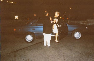 Item #16-4914 Original large format color photograph of Madonna getting into a car at Cannes....
