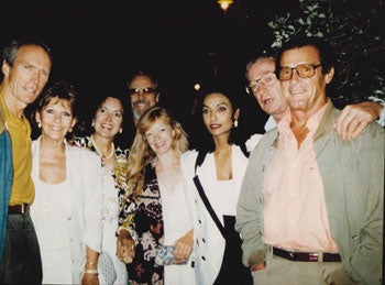 Cinquini, Alain (1941-2021), photographer - Original Large Format Close-Up Color Photograph of Clint Eastwood, Frances Fisher, Roger Moore, Luis Moore, Michael and Shakira Caine and George Schlatter at Cannes