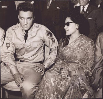 Dollinger, Nat; Gilloon Agneny; Agence France Presse - Elvis Presley in Military Uniform Sitting Next to an Indian Brahman Woman. Original Photograph
