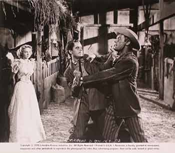 Item #17-1311 Evelyn Keyes, Glenn Ford, and Randolph Scott in “The Desperadoes”, 1943. Columbia Pictures.