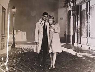 Item #17-1413 Nino Castelnuovo and Catherine Deneuve in Jacques Demy’s “The Umbrellas of...