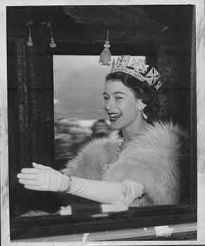 Item #18-0049 Queen Elizabeth wearing tiara, waves to the crowds as she drives through Horse...