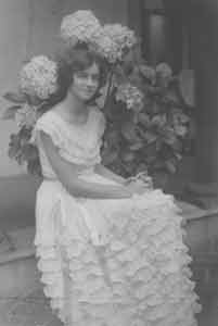 Item #19-7956 Portrait of unidentified young woman with hydrangeas. Unknown