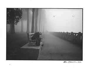Item #19-7964 Portrait of man kneeling on bench. Lou Stoumen