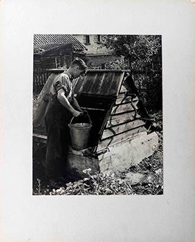 Item #51-1675 Boy Drawing Water for Local Well in Shipdham, England. Erwin Strohmaier