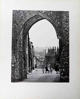 Item #51-1677 A view of Castle Acre, England with Women and Children through an Arch. Erwin...