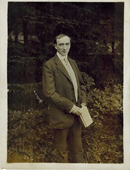 Item #51-4611 Original photograph of Henri Bataille holding a Book. Henri Manuel