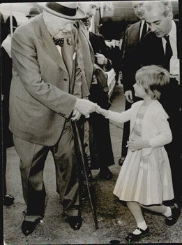 Item #51-5204 Sir Winston Churchill shaking hands with his private secretary's young daughter...