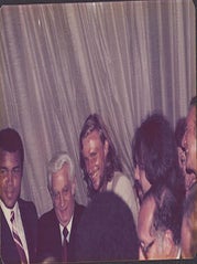 Item #51-7448 Photograph of Muhammad Ali along side Bj&ouml;rn Borg at the Victoria Club, London....
