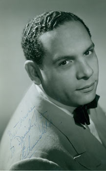 Item #63-2410 Signed Photograph of bandleader Edmundo Ros. David Bacon Collection, Zanton, Photography.