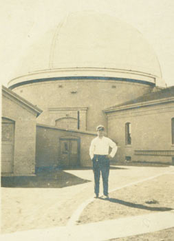 Item #63-2644 Photograph of man standing before an observatory. 19th Century American Photographer.