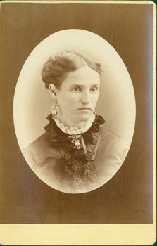 Item #63-2651 Photograph of lady in formal pose, ruff collar, brooch & earrings. Photographer J....