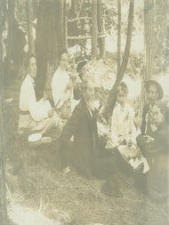 Item #63-2673 Photograph of a picnic in the woods with three men, three women and one boy,...