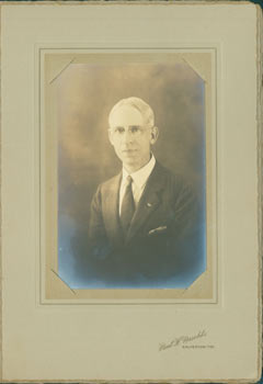 Item #63-2685 Photograph of man in suit with glasses. Paul H. Maschke, TX Galveston