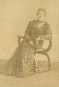 Item #63-2707 Monochrome Photograph of a woman seated in chair. 19th Century American Photographer