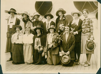 Pacific & Atlantic Photos, Inc. (New York) - Monochrome Photograph of Seven Women Standing Behind Five Women Kneeling, on Shipboard