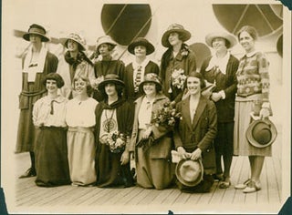 Item #63-2710 Monochrome photograph of seven women standing behind five women kneeling, on...