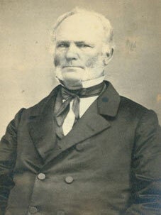 Item #63-2747 Black and White Photograph depicting man in formal pose with mutton chops, high...