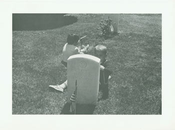 20th Century American Photographer - Black and White Photographic Print of Two Children Playing Behind Gravestone of Lt. Col. Roy Harold Swanson Us Air Force (1912-1961)