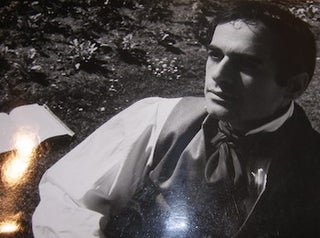 Item #68-4283 B&W Photo French actor reflecting, with open book on ground behind him. Maurice ....