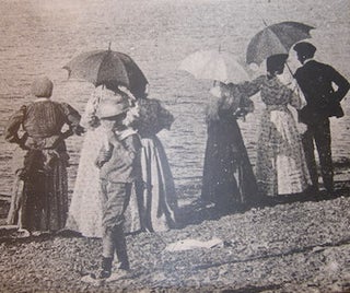 Item #68-4373 Copy of photograph of people holding umbrellas at a shoreline. 20th Century French...