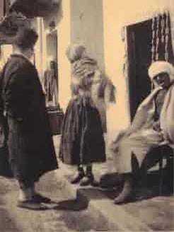 Item #68-8981 Biskra (Algeria) seated & standing before doorway. 1930s Sahara photographer