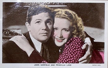 Item #70-0153 John Garfield and Priscilla Lane. (Scene from the motion picture "Dust Be My Destiny."). 20th Century Photographer.