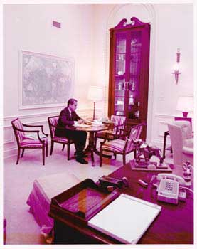 Item #70-0699 Original official White House photograph of President Richard Nixon working in his...