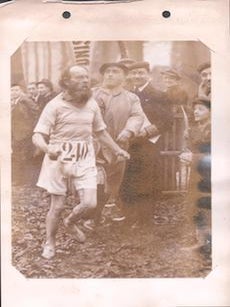 Man running in race. French Photographer.